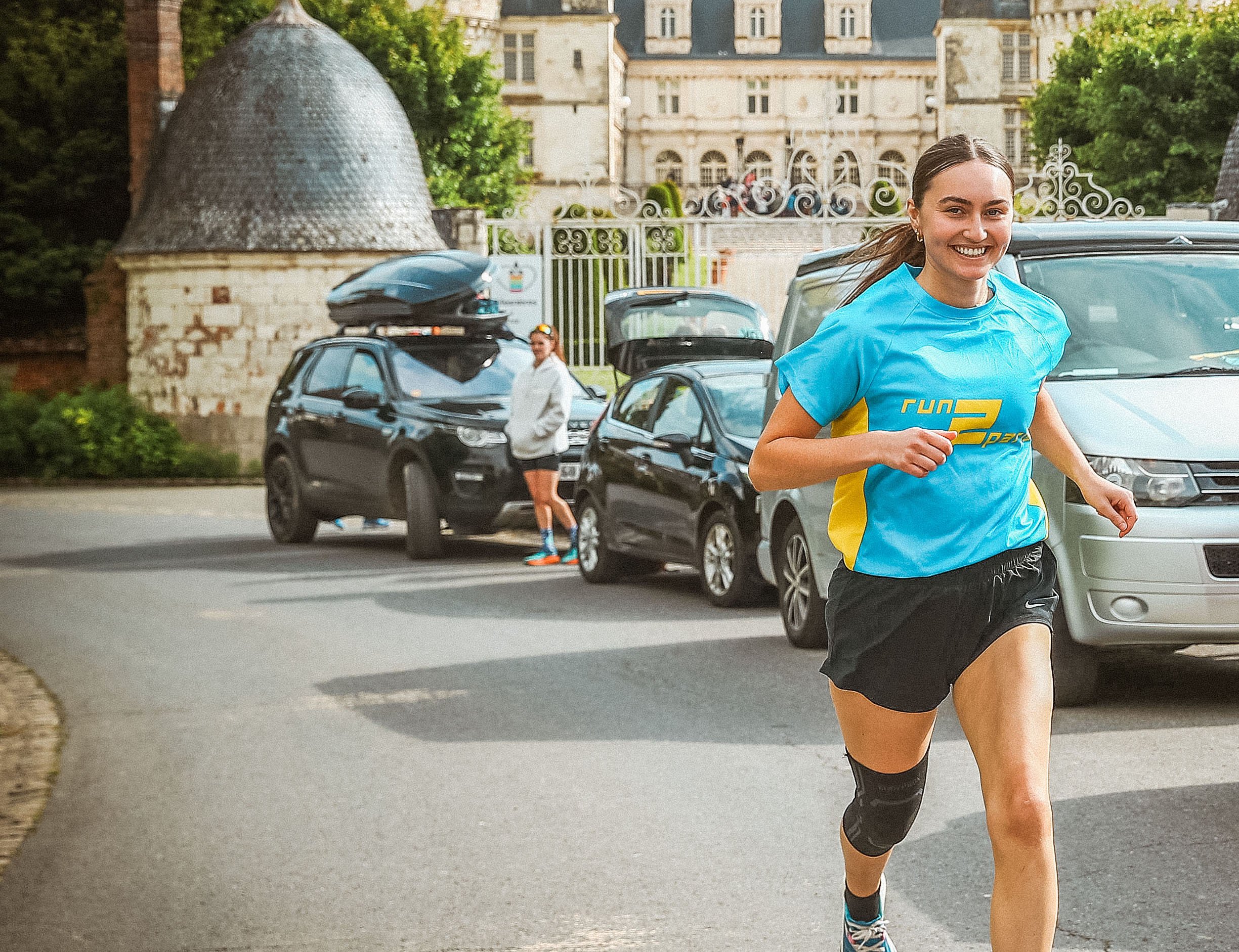 Run2Paris relay race from London to Paris, featuring runners and support vehicles.