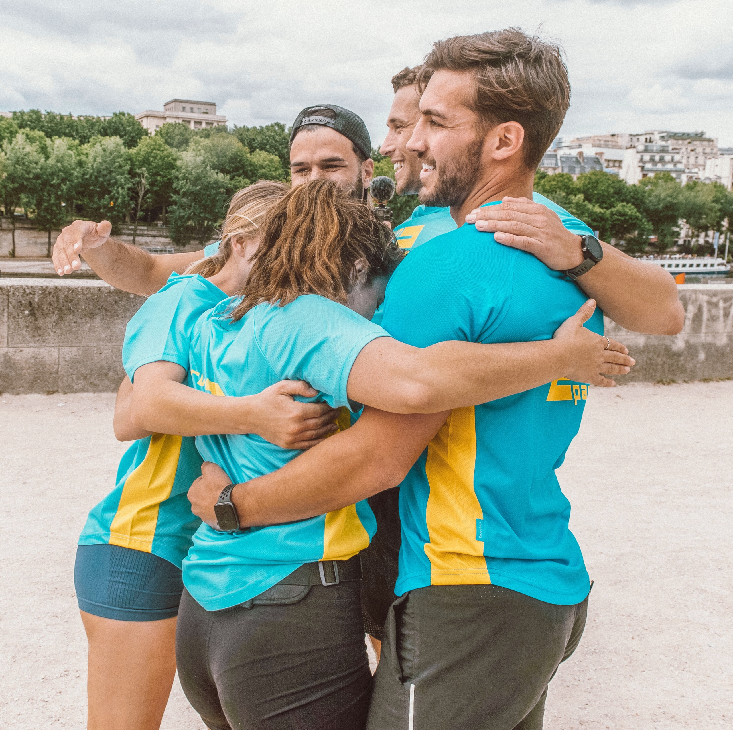 Team huddle after running relay from London to Paris for Run2Paris event.
