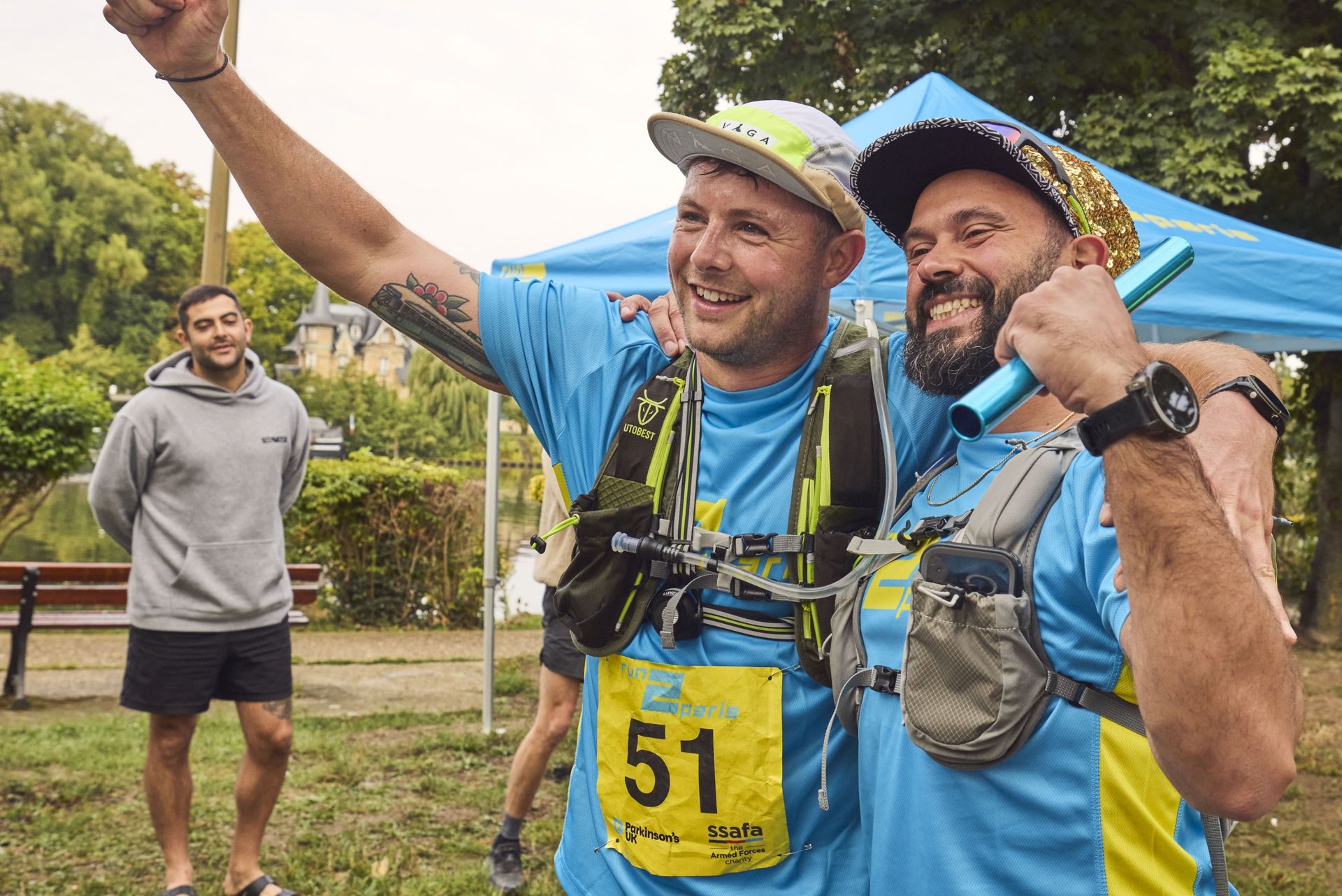Happy runners celebrating after completing the relay from London to Paris.